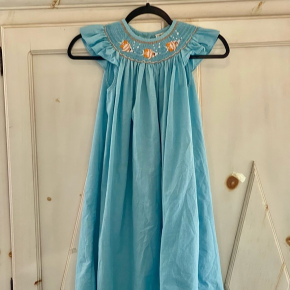 Castles & Crowns Other - Castles & Crowns Smocked Dress Size 7
w/yellow fish
Aqua Blue Plaid Cap Sleeves